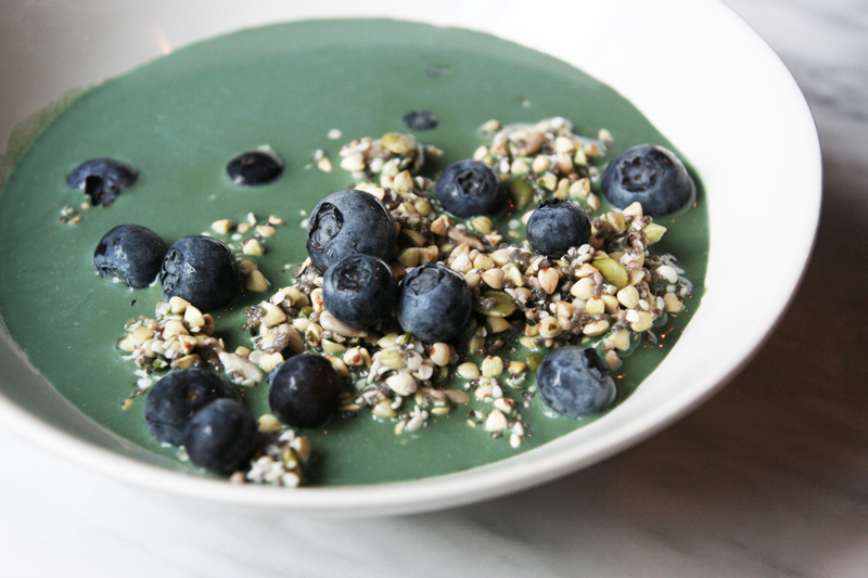seed muesli with blue-green spirulina milk and blueberries